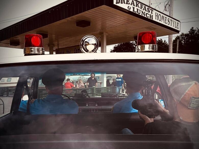 A scene from the set of Painted Sharks outside Sandy's Deli in Renfrew, Ont.