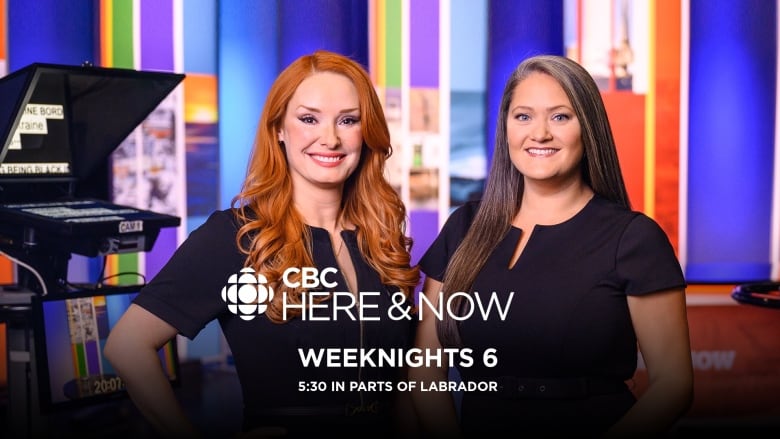 Two women stand in a brightly coloured television studio. A camera is to the left of the frame. 