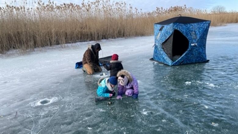 Children playing on a frozen lake.