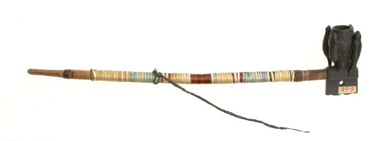 A Mi'kmaw pipe crafted with wood and porcupine quills.