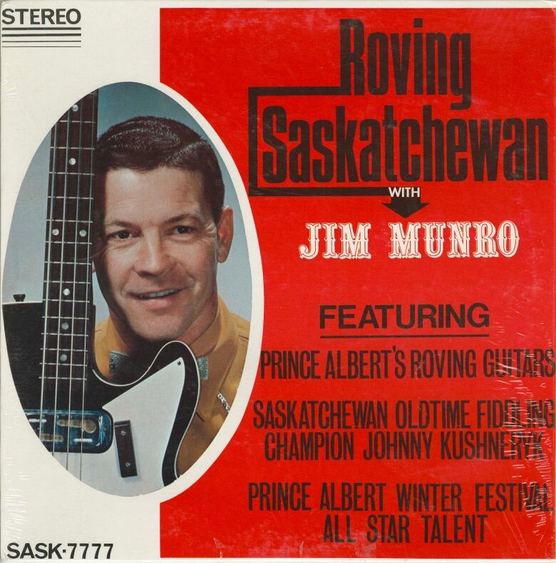 Album cover with large text on the right and a man holding a guitar inside a circle on the left