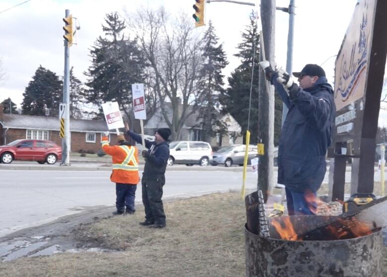 Employees from Windsor Salt stand on the picket line Friday.