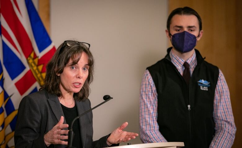 Sonia Furstenau is pictured speaking at a podium with Dr. Alex Nataros standing beside her. 