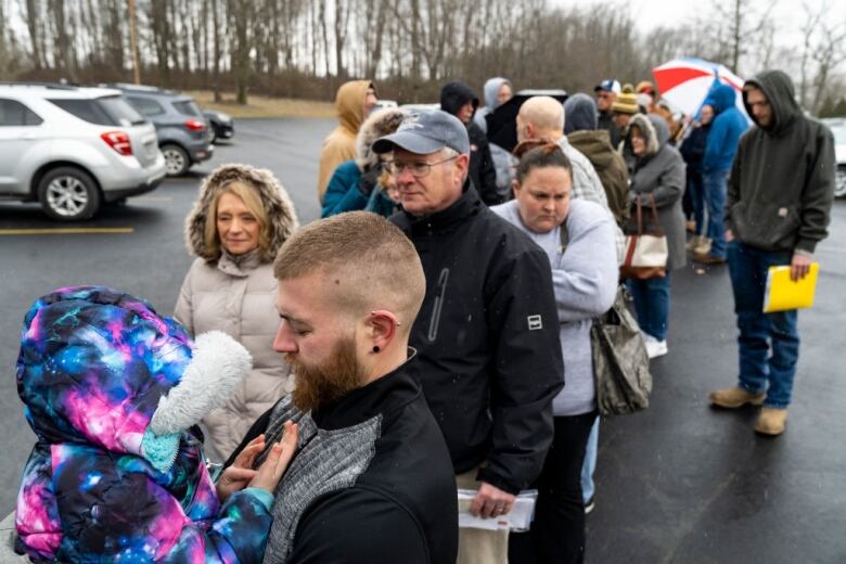 People line up outside.