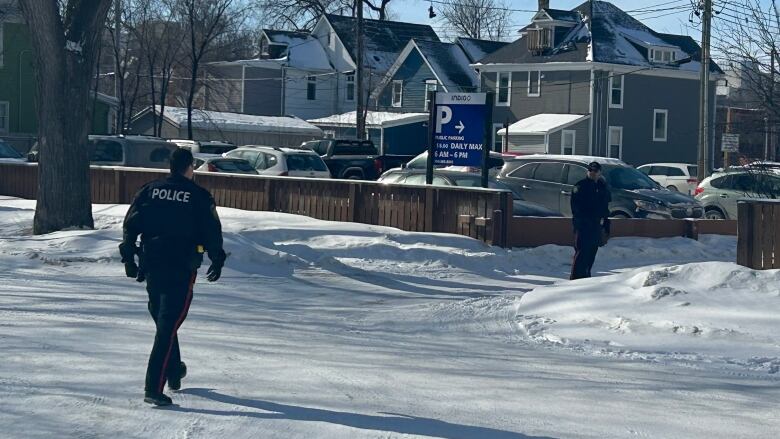 Officers walk in the winter.