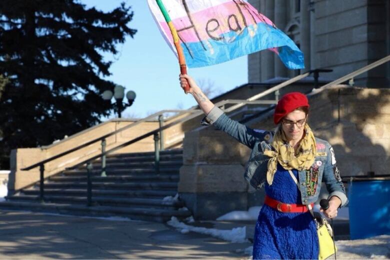 A transgender activist protests at the legislative building in Regina, Saskatchewan. 