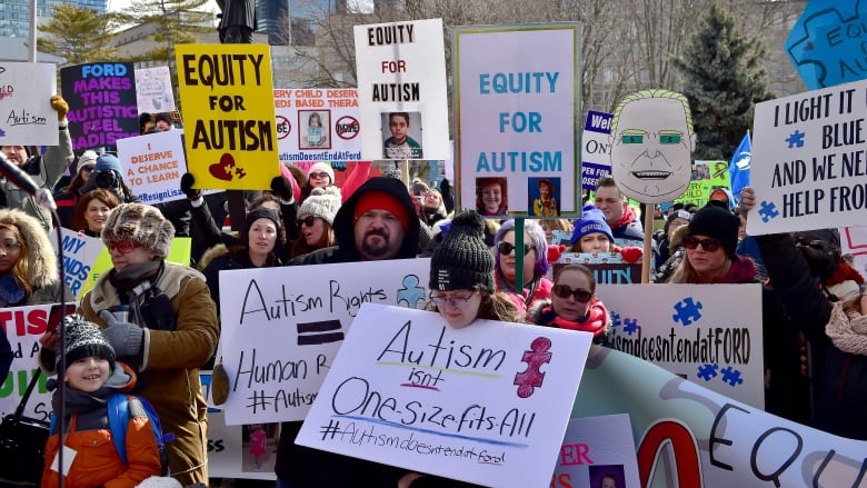 Parents, therapists and union members gather outside Queen's Park on March 7, 2019, to protest changes to Ontario's autism program.