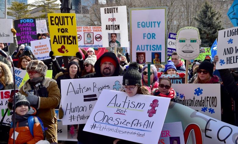 Parents, therapists and union members gather outside Queen's Park on March 7, 2019, to protest changes to Ontario's autism program.