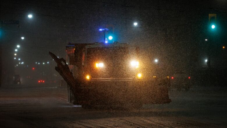 A snowplow is driven through blowing snow in Torontos Beaches neighbourhood on Feb. 22, 2023.