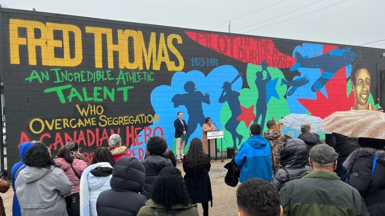 Irene Moore Davis, President, Essex County Black Historical Research Society and Liberal MP Irek Kusmierczyk unveiled the three murals to honour the legacy of several residents ofthe McDougall Street Corridor, a historicallyBlack neighbourhood in Windsor.