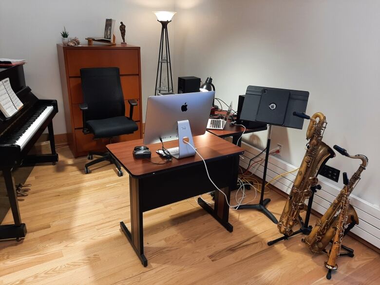 Various instruments, including a piano and baritone saxaphone, are shown in a studio.