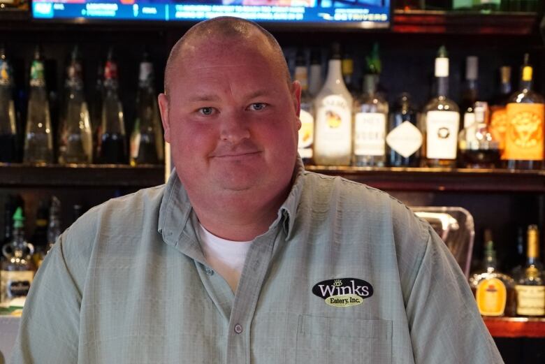 A man standing at a bar