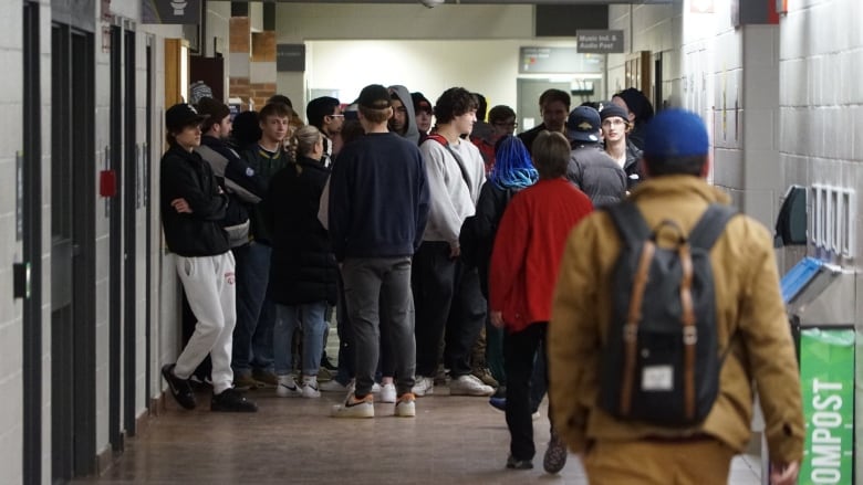 crowd of people in a hallway