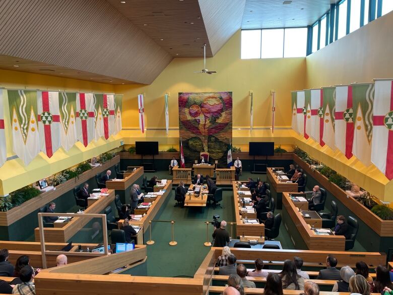 A view of a government assembly, seen from the gallery above.