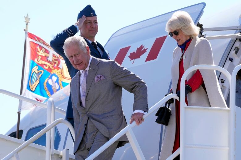 Charles and Camilla are seen disembarking their plane in Yellowknife.