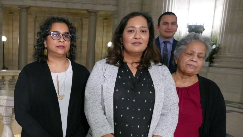 Women standing in the rotunda of the Manitoba Legislative Building.