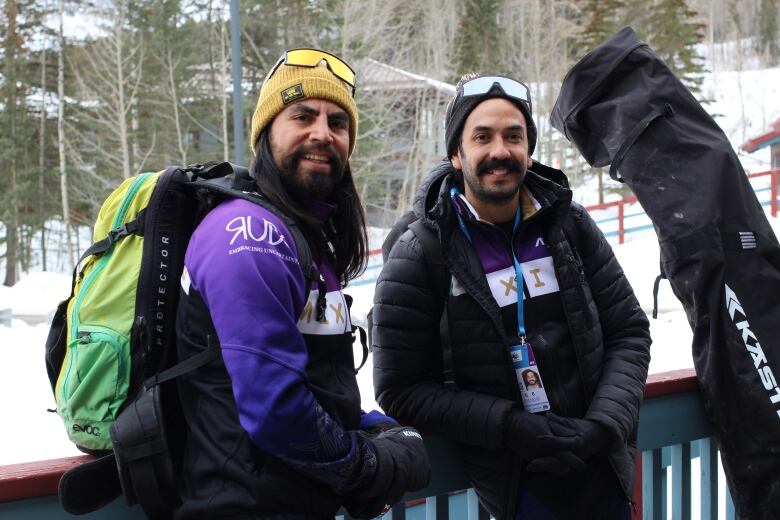 Christopher Gomez and Raul Antonio Figueroa stand outside their wax trailer at the Canmore Nordic Centre on March 1, 2023. 