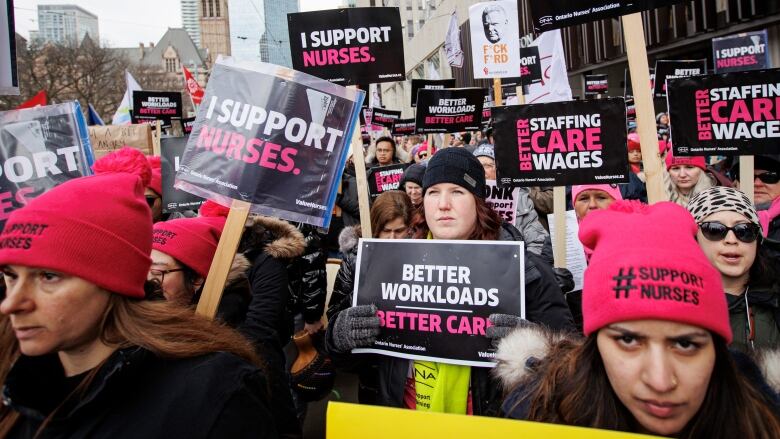 Nurses hold a rally in downtown Toronto.