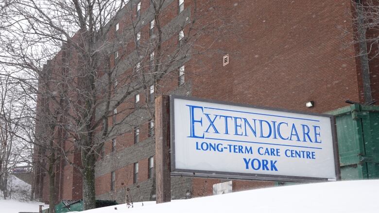 The outside of a large brick building with a sign that says, Extendicare York Long-Term Care Centre.