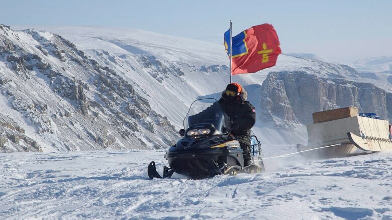 RCMP officer Cpl. Tom Cooke, from Pelly Bay, Nunavut, rides his snowmobile up a hill on Thursday March 29, 2007 en route to Alexandra Fjord as part of sovereignty patrol Operation Nunalivut. Cooke's uncle manned the RCMP outpost at Alexandra Fjord in the 1950s. A 24-member Canadian Forces patrol left March 17 for a 8,000-kilometre trek by snowmobile to confirm Canada's sovereignty in the High Arctic and to check for signs of polar bear hunters.