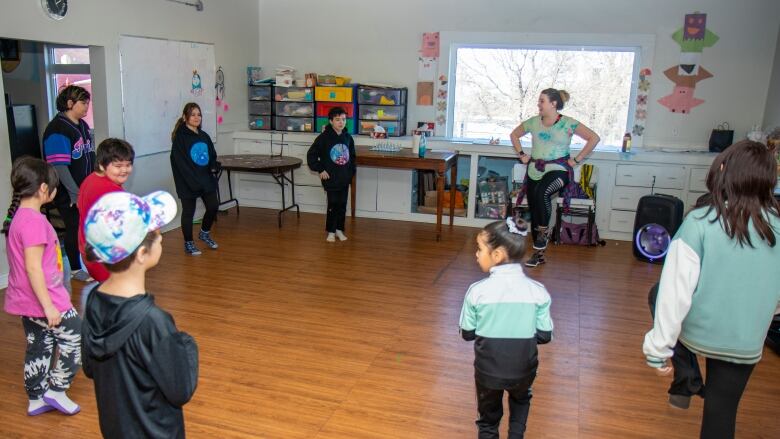 Kids dance to a Zumba workout.