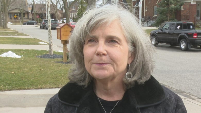 Melinda Munro stands outside on the street