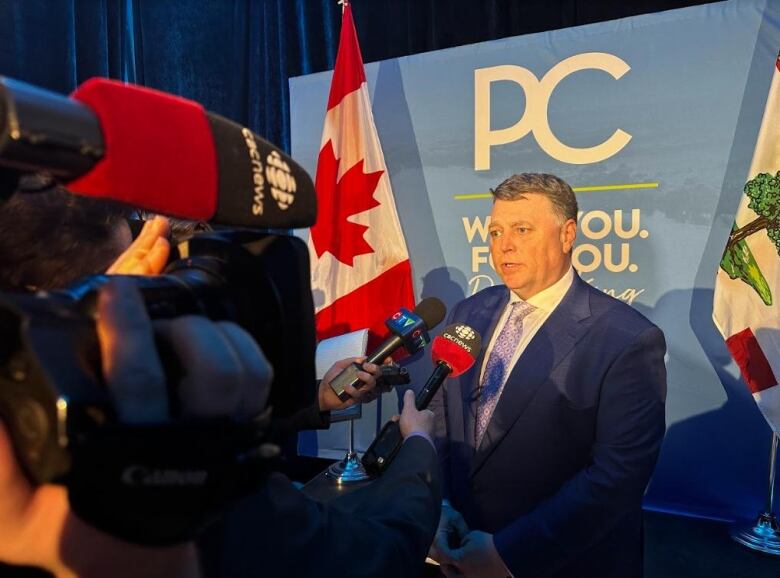 PC Leader Dennis King stands in front of reporters after his nomination meeting.