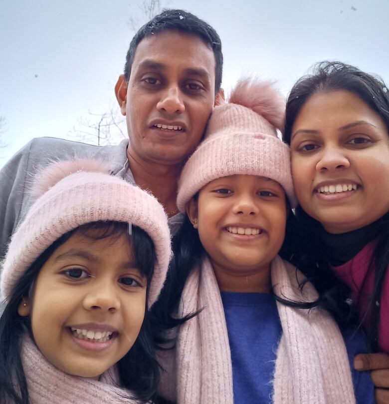 Buddhika Jayawardana, her husband and two daughters