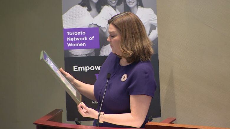 Toronto Deputy Mayor Jennifer McKelvie proclaimed March 8 as International Women's Day in Toronto. She is reading the proclamation in this photo.