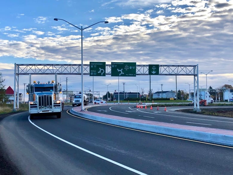 Vehicles drive along the new roundabout near Cornwall P.E.I.