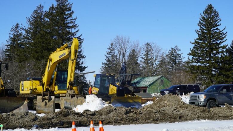 Construction equipment and machinery working on a site.