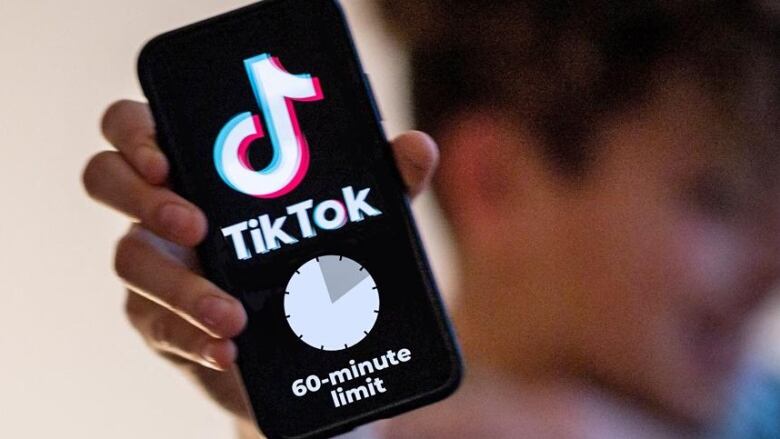 TikTok app displayed on a smart phone, saying 