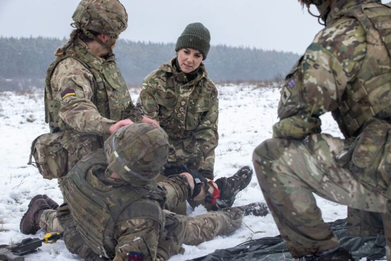 People take part in a military training exercise.