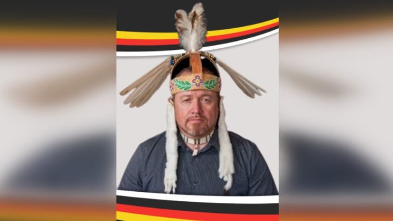 A profile photo of a man wearing a ceremonial headdress.