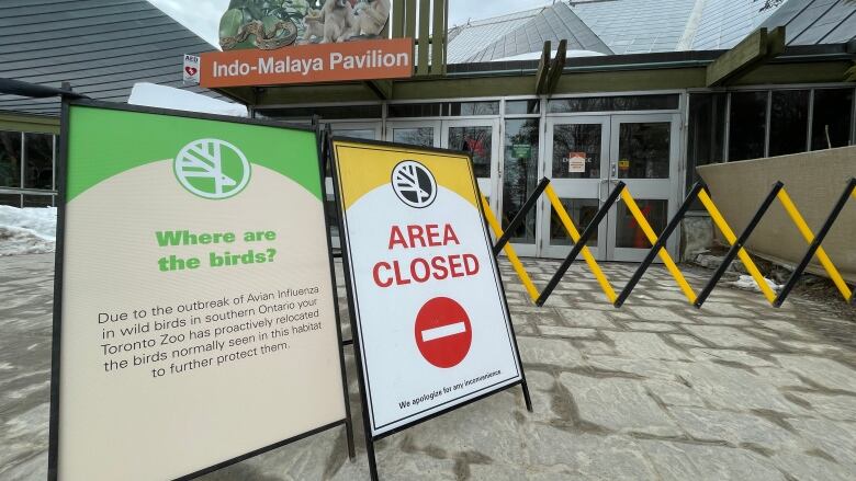 Signs advise Toronto Zoo visitors that the aviaries are closed after an outbreak of bird flu was confirmed in southern Ontario.