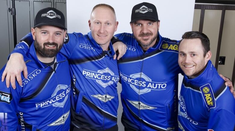 Four curlers pose for a shot during a recent tournament