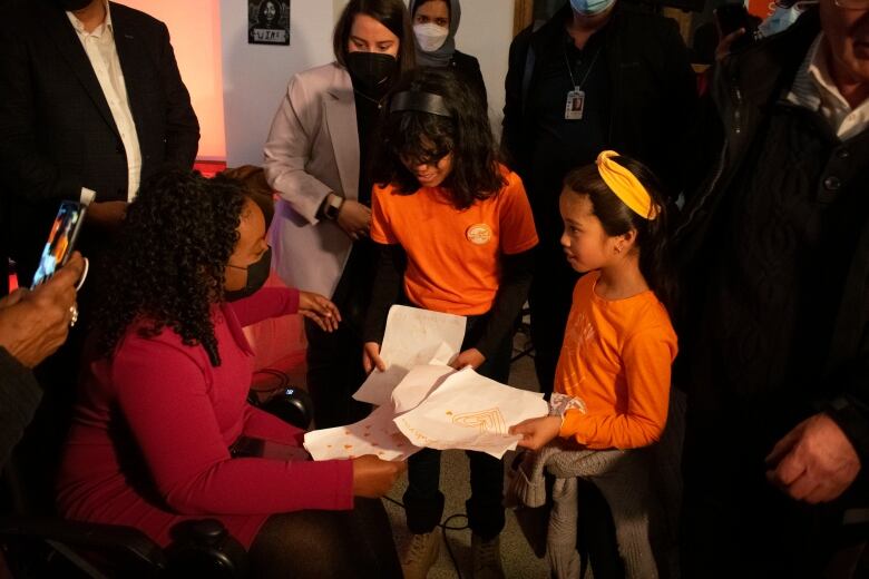 A woman and two young girls.