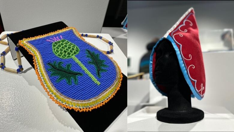 Blue beadwork with green leaves on it sits on the left. A red hat with blue trim is on the right.