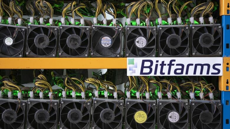 Miners at work at the Bitfarms bitcoin mine in Magog, Que., on May 8, 2019.