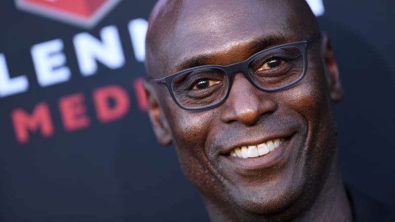 A close up photo of an actor on a red carpet.