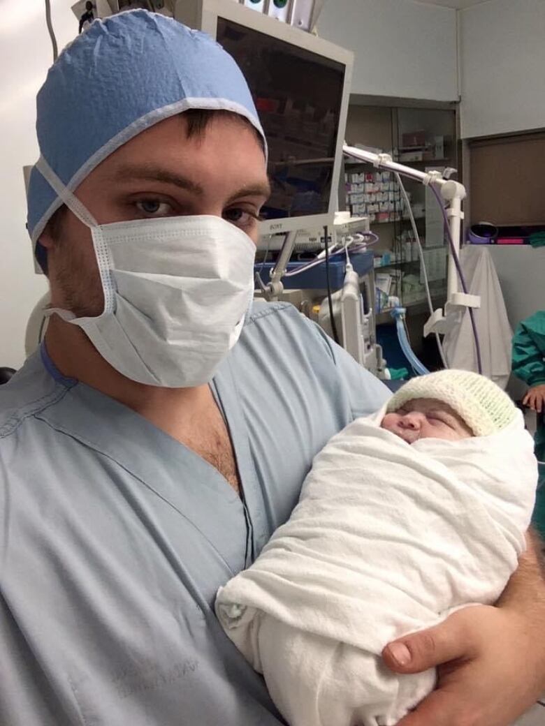 Adult photo of Mitchell Sveinbjornson after his daughter was born by caesarean section