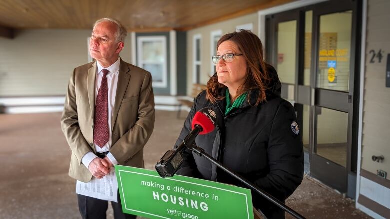 Green Leader Peter Bevan-Baker and candidate Karla Bernard making campaign announcements at a podium.