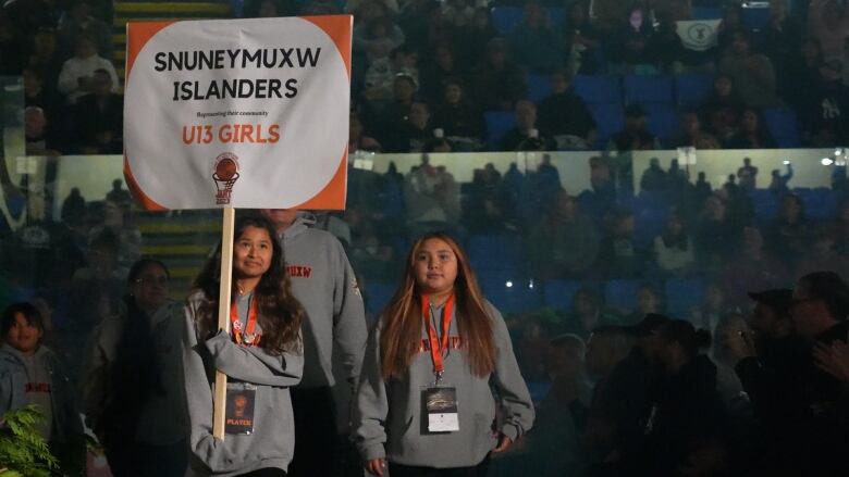 The under 13 Snuneymuxw Islanders enter the opening ceremonies at JANT 2023. 