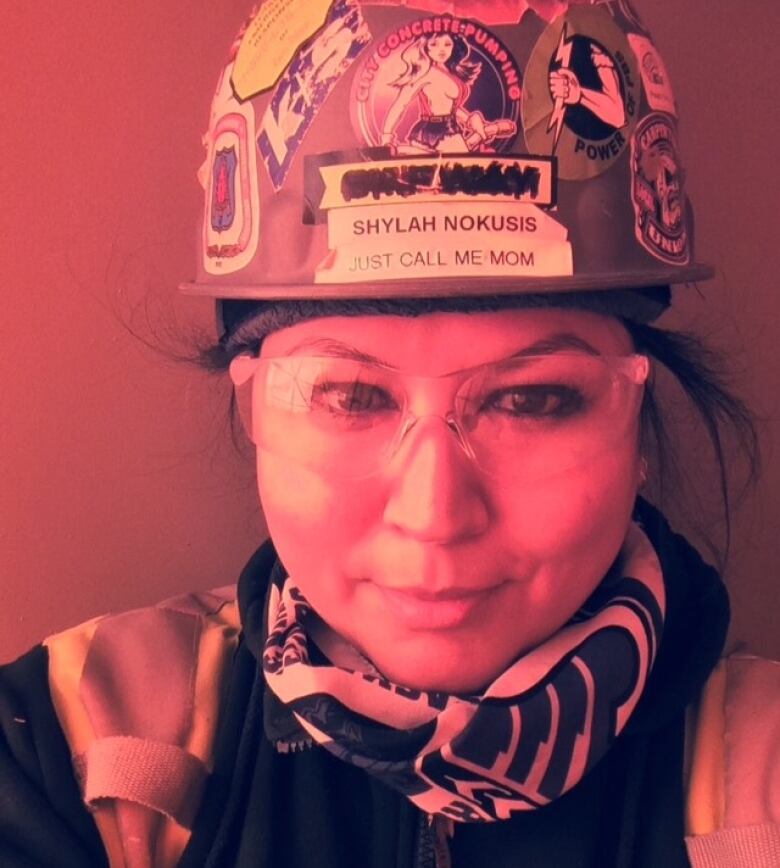 Shylah Nokusis wears a hardhat. 