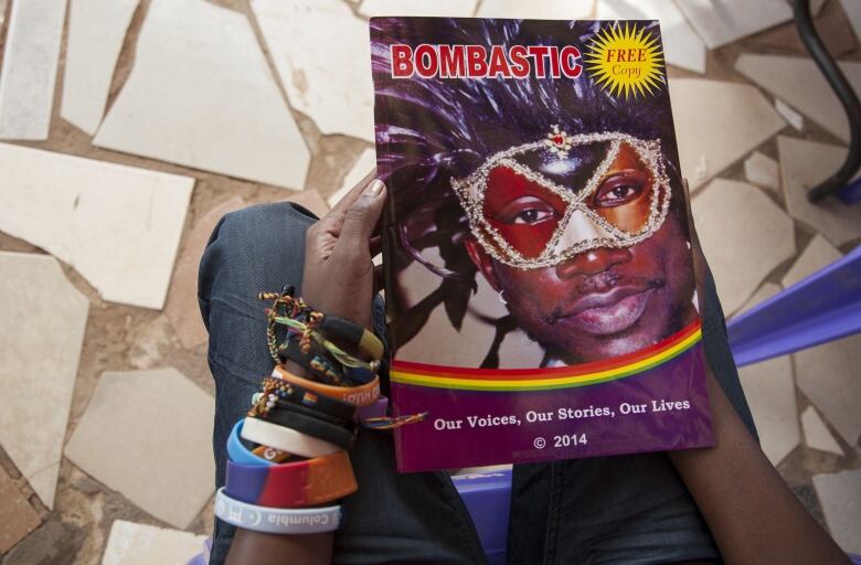 Cover of a magazine called Bombastic, with photo of a face of someone wearing face pain and a mask around their eyes.