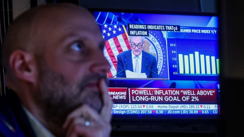 Traders react to Fed rate announcement on the floor of the NYSE in New York