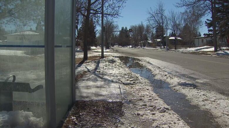 Water flows down a street.