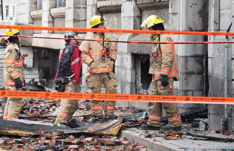 Firefighters in front of building