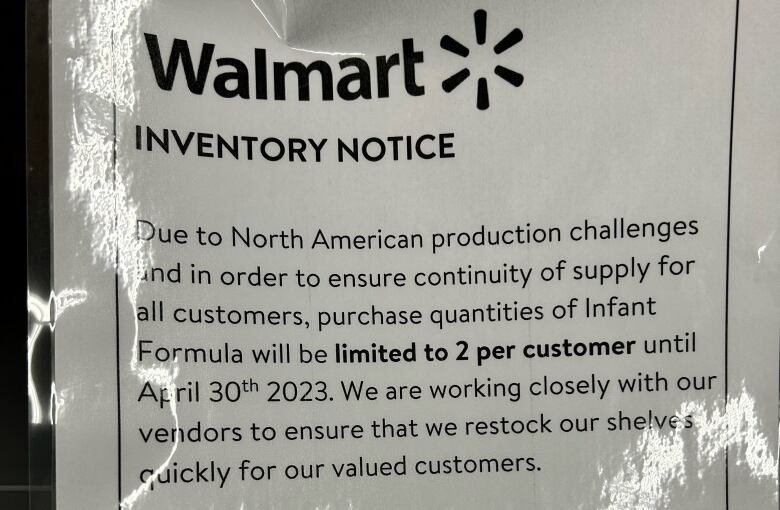 A sign in Walmart saying people can only take two baby formulas at a time.