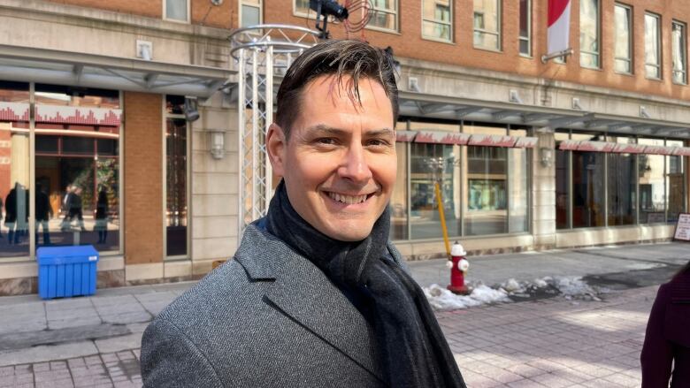 Michael Kovrig walks down Sparks Street in Ottawa ahead of U.S. President Joe Biden's address to Parliament on March 24, 2023.